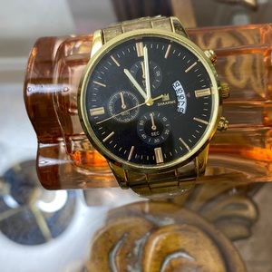 Gold  Men watch Stainless Steal.